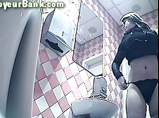 Slender busty blonde is peeing on the video
