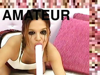 Pigtailed amateur brunette with blurred makeup sucks a dildo