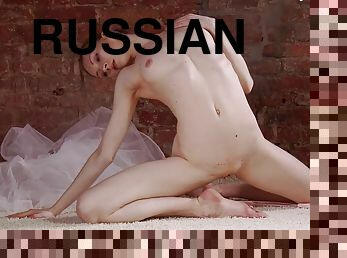 Arousing Russian ballerina goes nude and reveals her pale body