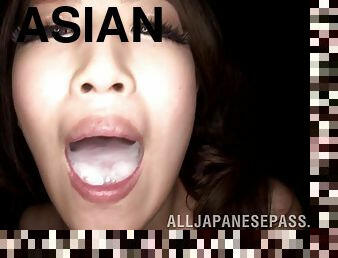 Cumshots land on the tongue of a cute Asian cocksucker