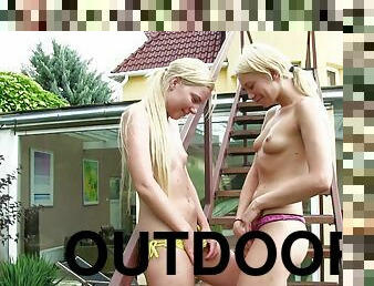 Lindsey Olsen and Angie Koks kissing and scissoring outdoors