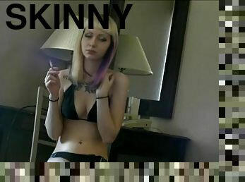 Bikini girl smokes in the hotel room