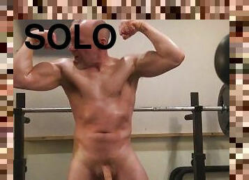 Oiled up Muscle Daddy poses and flexes and jerks his big 7" cock