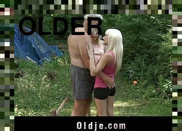 Two wild babes invite an older man to a threesome in the forest