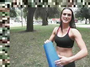 Misty Anderson does yoga in a public park
