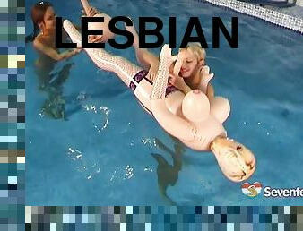 Underwater play with a pair of naked teen lesbians