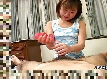 Cute Asian cocksucker uses a sex toy on him