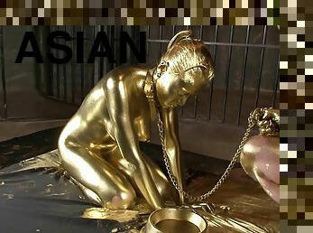 Hot slave girl painted in gold loves playing with a throbbing dick