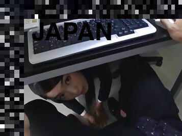 Japanese office worker sucks a guy's dick while under a desk