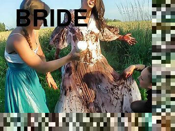 Girls cover the pretty bride in dirty mud and strip her