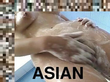 Beautiful Asian girl gives head and gets bent over for sex