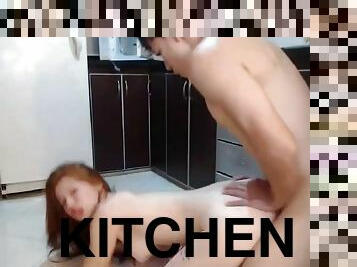 Fucks redhead girlfriend in the kitchen