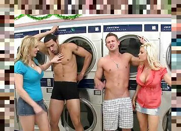 Two hot blondes have a foursome CFNM sex in a laundry