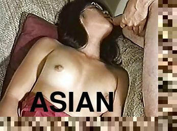 Asian chick in glasses fondles her pussy and sucks a dick