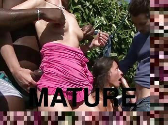 Mature ladies internationally fucked in an outdoor orgy