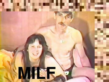 Chubby brunette milf sucks her man's dick in a vintage video