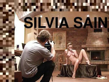 Silvia Saint takes her clothes off and poses at a photo shoot