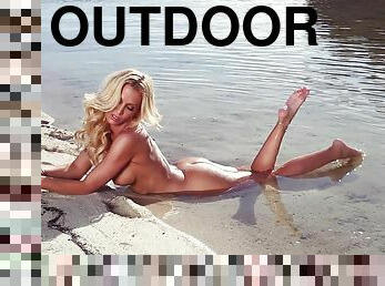 Super hot model is posing naked by the lake