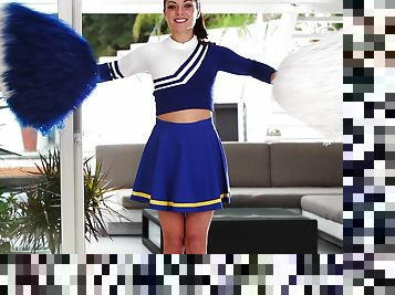 Stunning Gigi Marie poses in cheerleader uniform