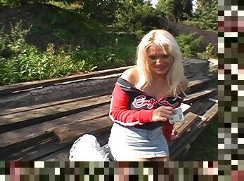 Sexy blonde in a miniskirt sucks a dick and gets nailed outdoors