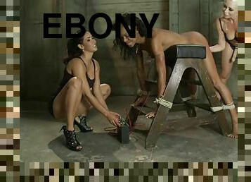 Dominant Blonde and Brunette Playing with a Submissive Ebony in BDSM