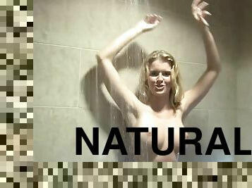 Charming blonde shows off her natural beauty while taking a shower