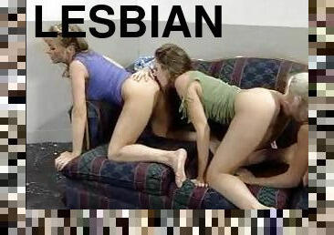 Three salacious lesbians enjoy licking each other's holes indoors