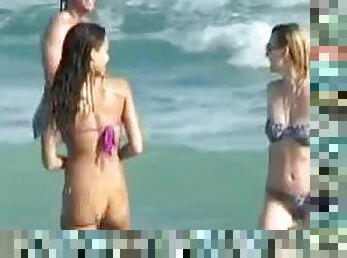 Jessica Alba wearing a purple bikini gets caught on voyeur's cam on a beach