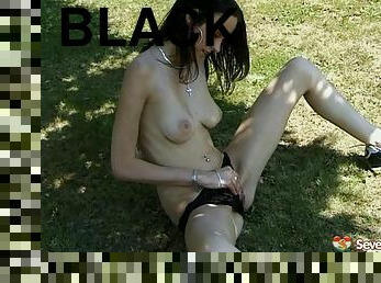 In the grass with a masturbating teen chick in black panties