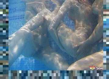 Icy hot lesbian babes get frisky in the pool in an enticing threesome