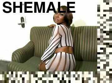 Shemale with big chocolate buttocks shows off each part of her body