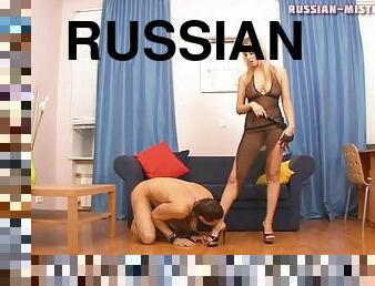 Hypnotized Russian damsel stepping on her slave head while spanking him lovely in femdom shoot