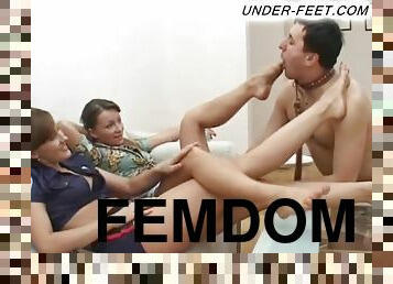 Foot fetish femdom cop relaxing while slave licks her toes