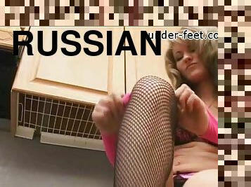 Fascinating Russian foot fetish shoot in fishnet stockings
