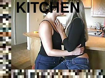 Horny blonde chicks finger their pussies in a kitchen