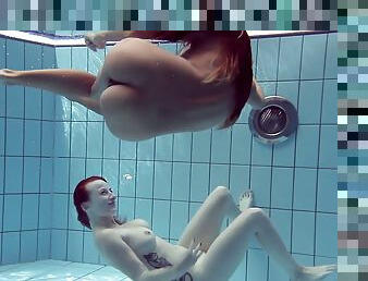 Pair of Russian lesbians exposing their sexy bodies in the pool