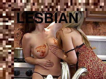 Lesbians eat some food and some pussy on the kitchen counter
