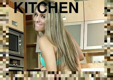 Nessy Wild finger-fucks her smooth coochie in the kitchen