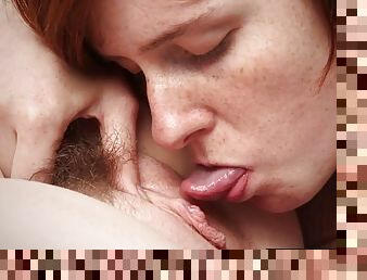 Lesbian redheads lick and finger hairy pussies