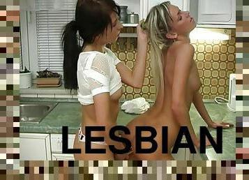 Lustful blonde and brunette enjoy steamy lesbian sex in the kitchen