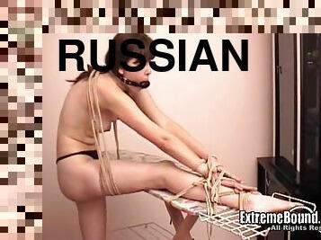 Very submissive Russian bitch gagged and tied to the ironing bord