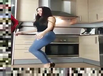 Hot brunette dancing in the kitchen for you