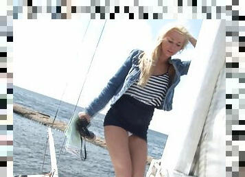 Leggy blonde beauty stripping on a yacht to flaunt her hot body