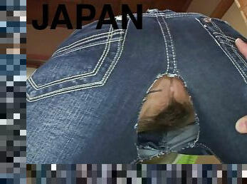 Japanese bimbo in crotchless pants pleasing two dicks on her knees