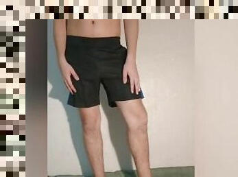 A guy shows what a chastity belt looks like under his clothes - a chastity cage in shorts