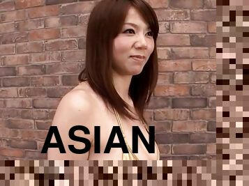 Cute face Asian enjoys giving a sensual titjob