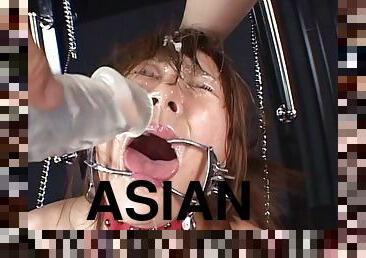 Naughty Asian in bondage is tortured and acquires facial bukkake