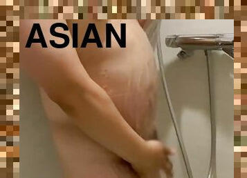 A chubby Asian guy with a fat belly and a small cock takes a shower