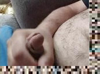 Hairy bear strokes on the couch and blows a sticky mess