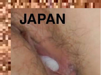 Japanese beauty cracking her wet pussy in nasty action